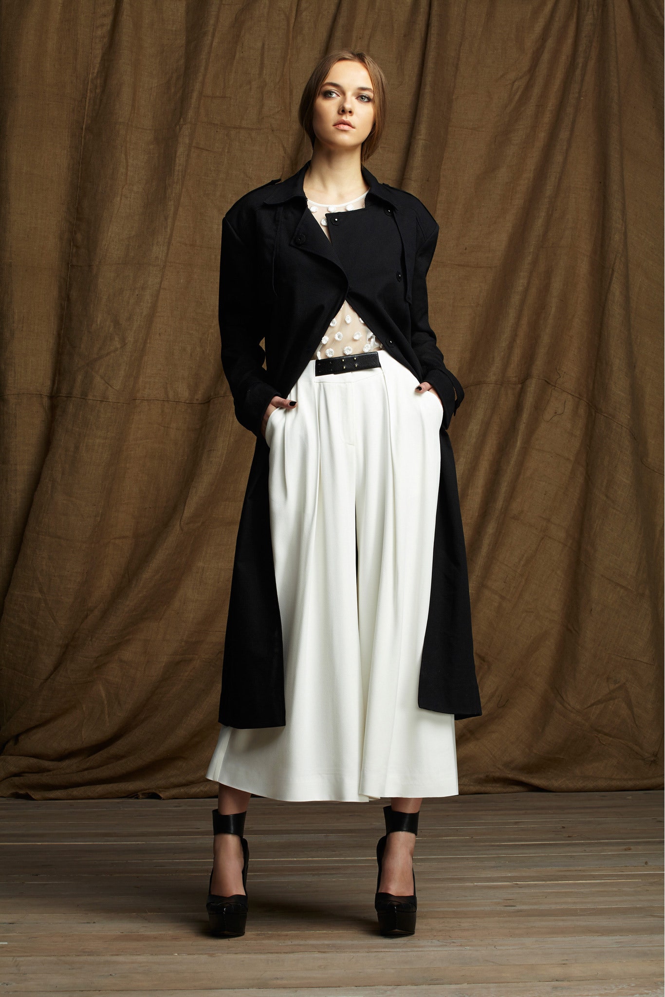 black coat white top and pants