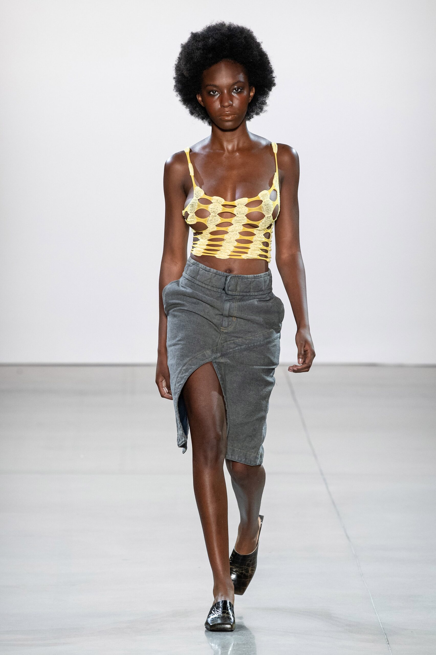 fitted yellow cutout top and gray skirt