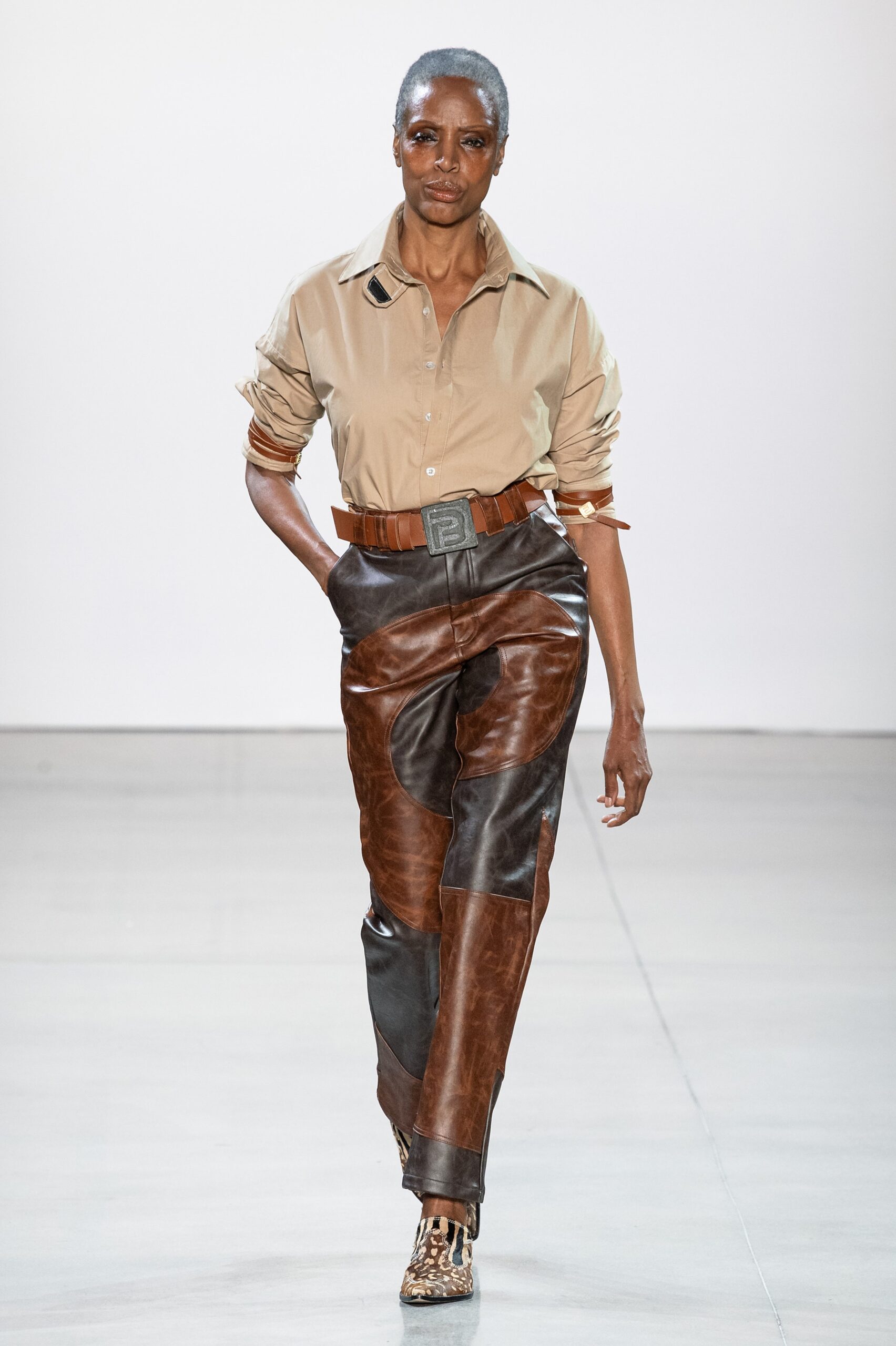 beige shirt brown leather pants