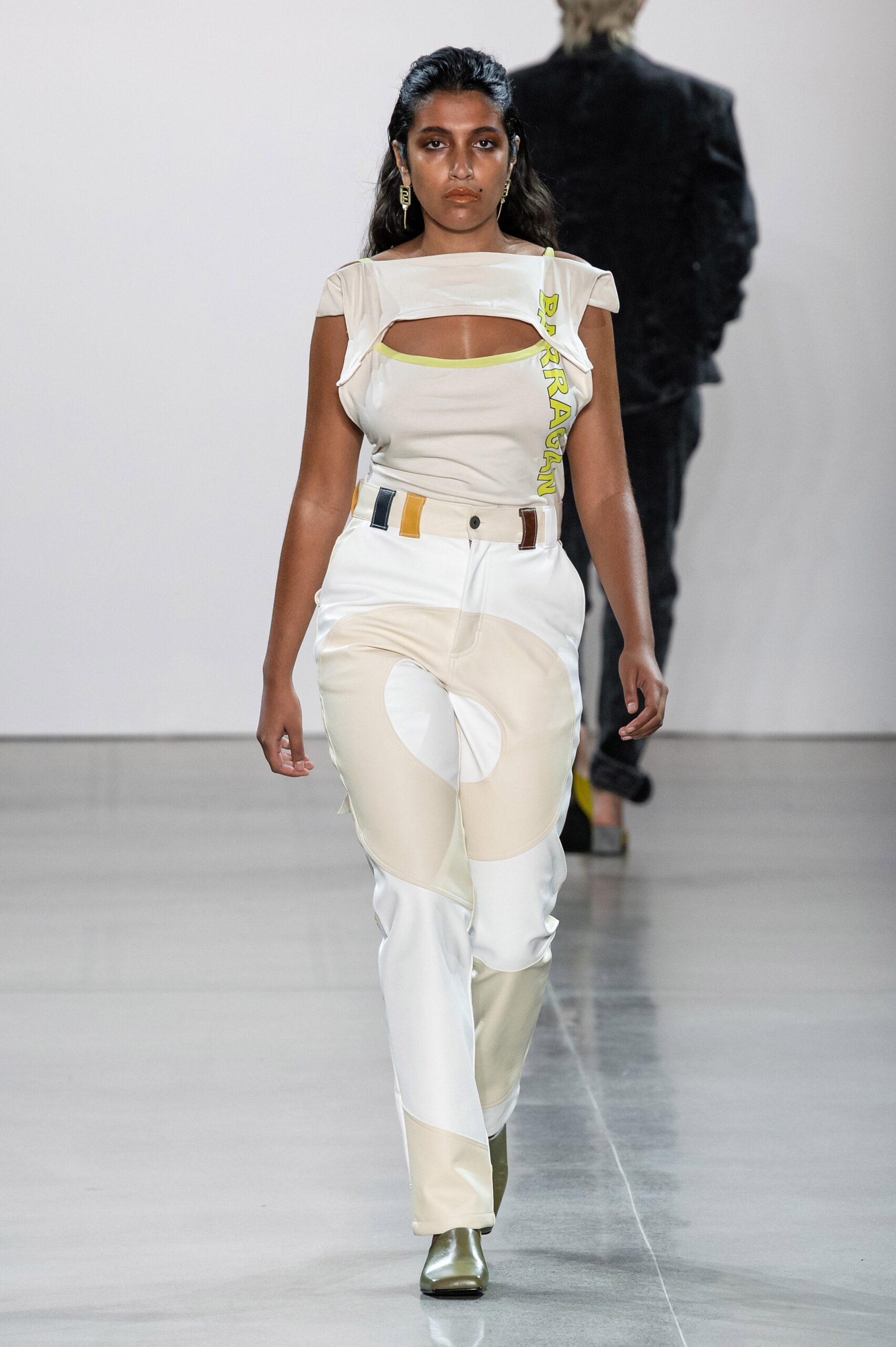 beige mesh top and white pants