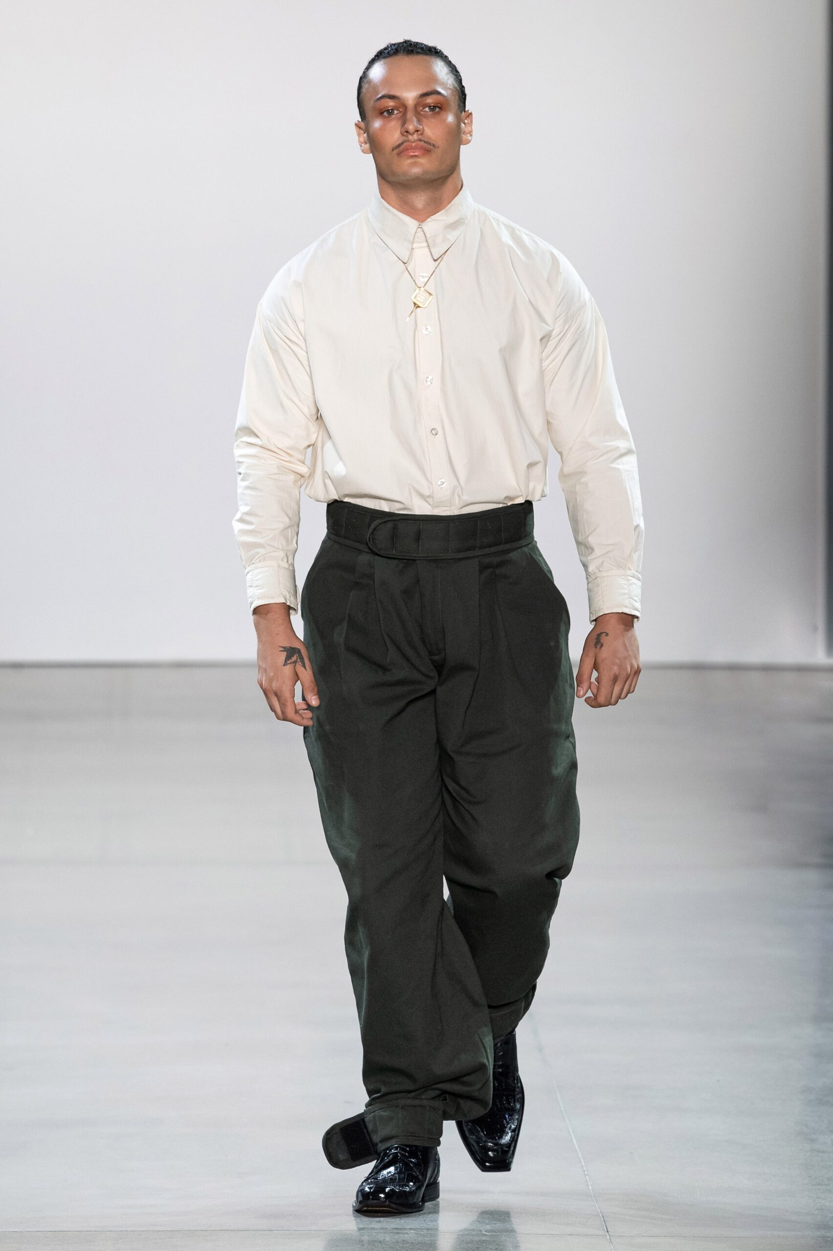 white relaxed shirt black pants