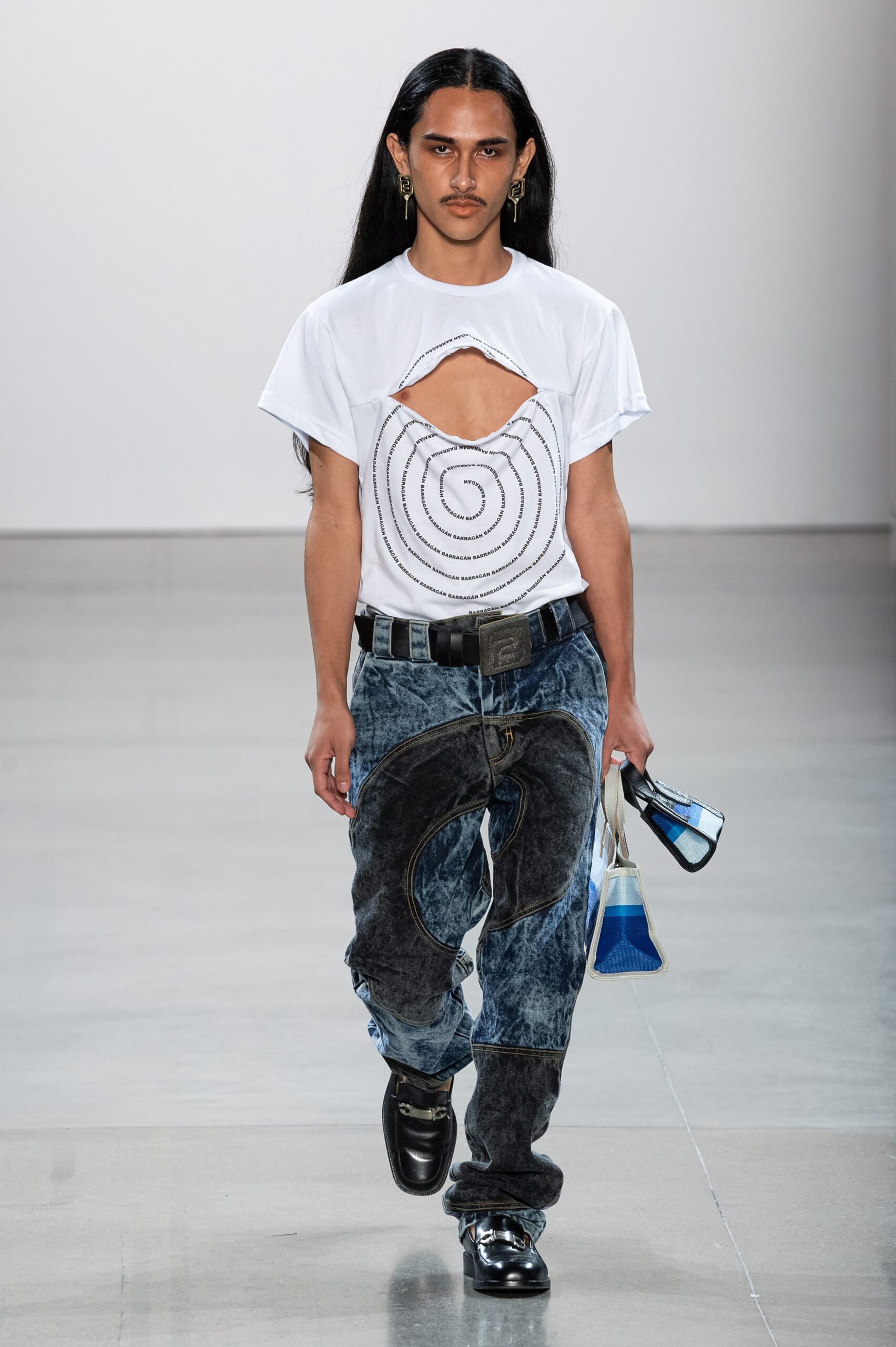 white cutout t-shirt and blue jeans