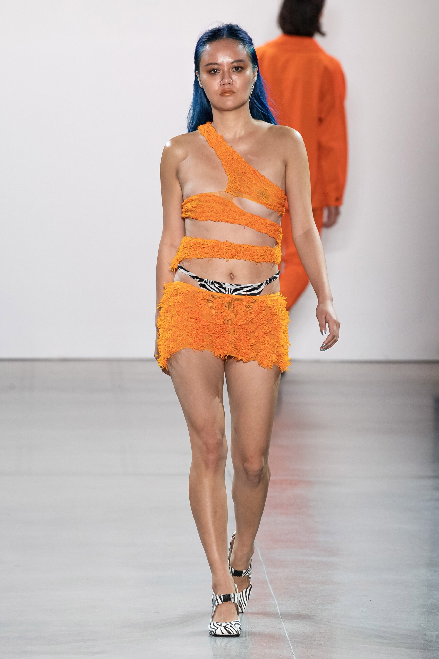orange lace crop-top and mini skirt