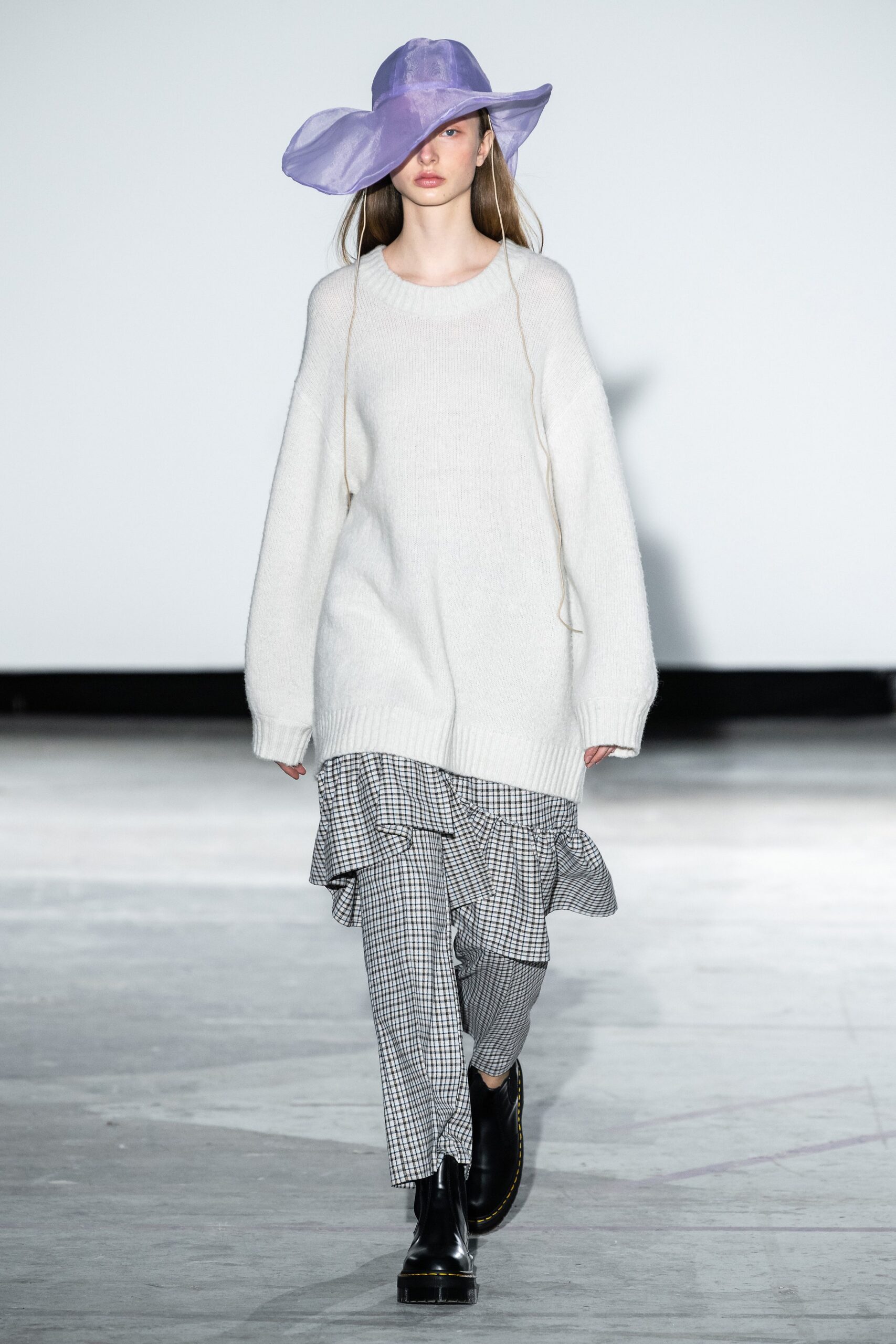 oversized white sweater with ruffled pants