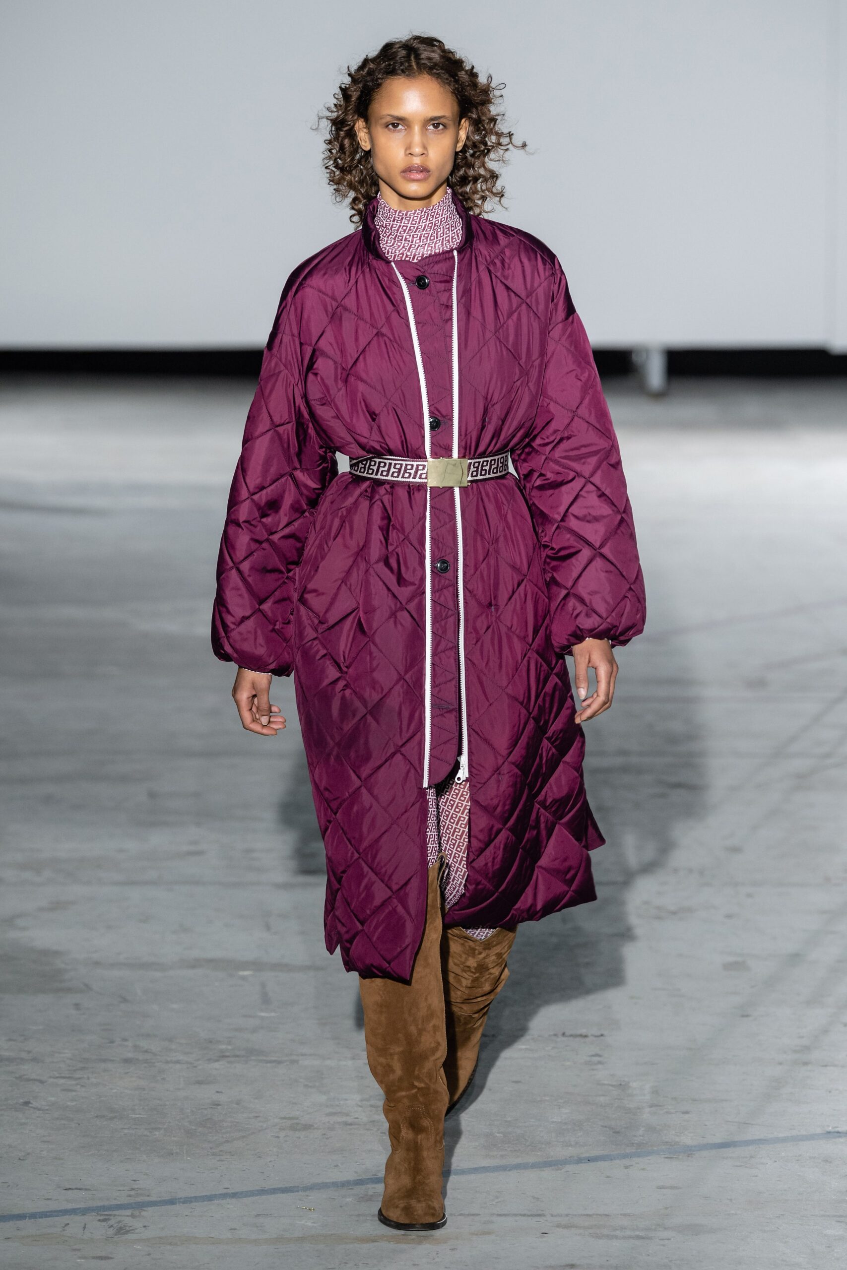 purple quilted coat with red dress