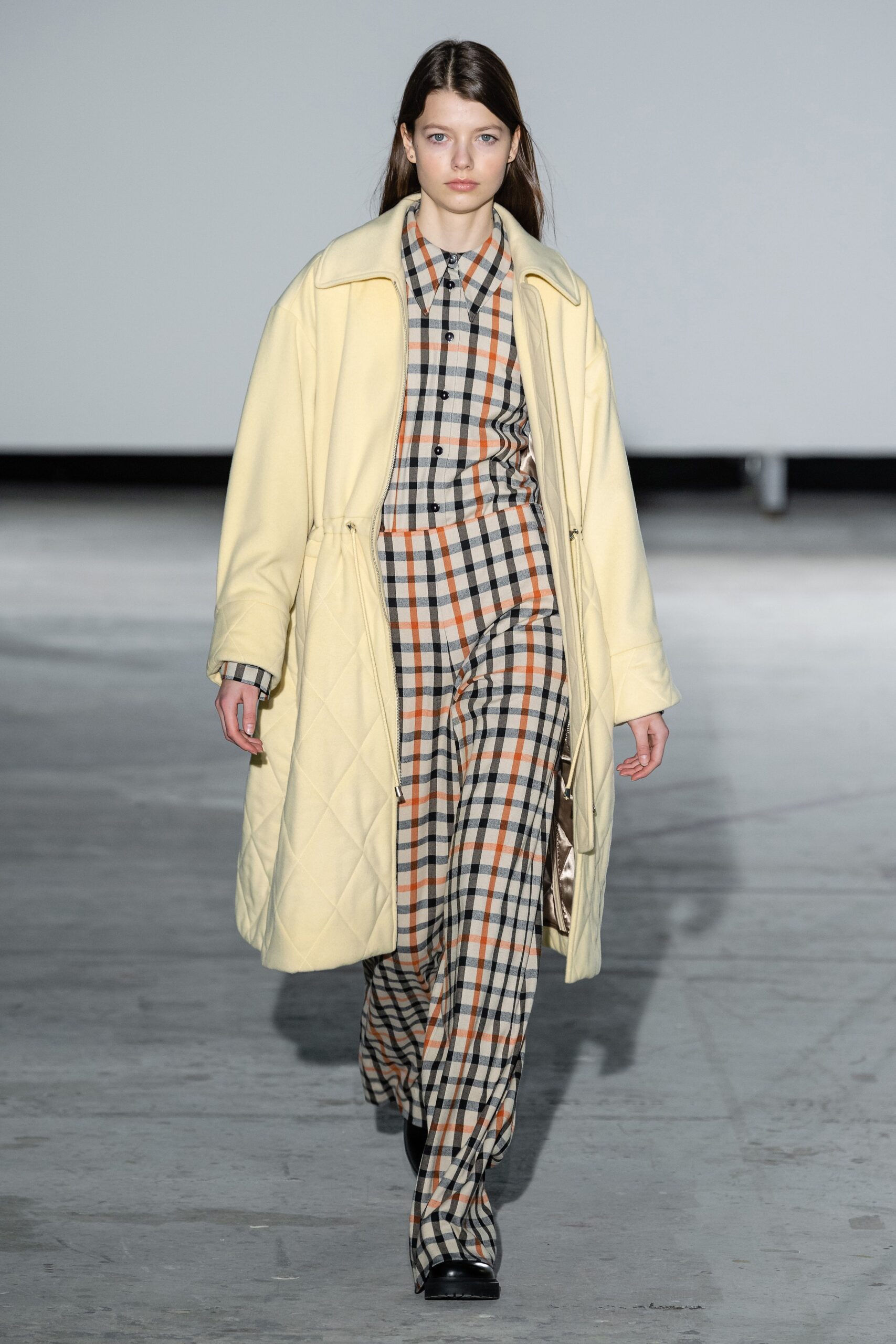 yellow quilted coat with checked outfit