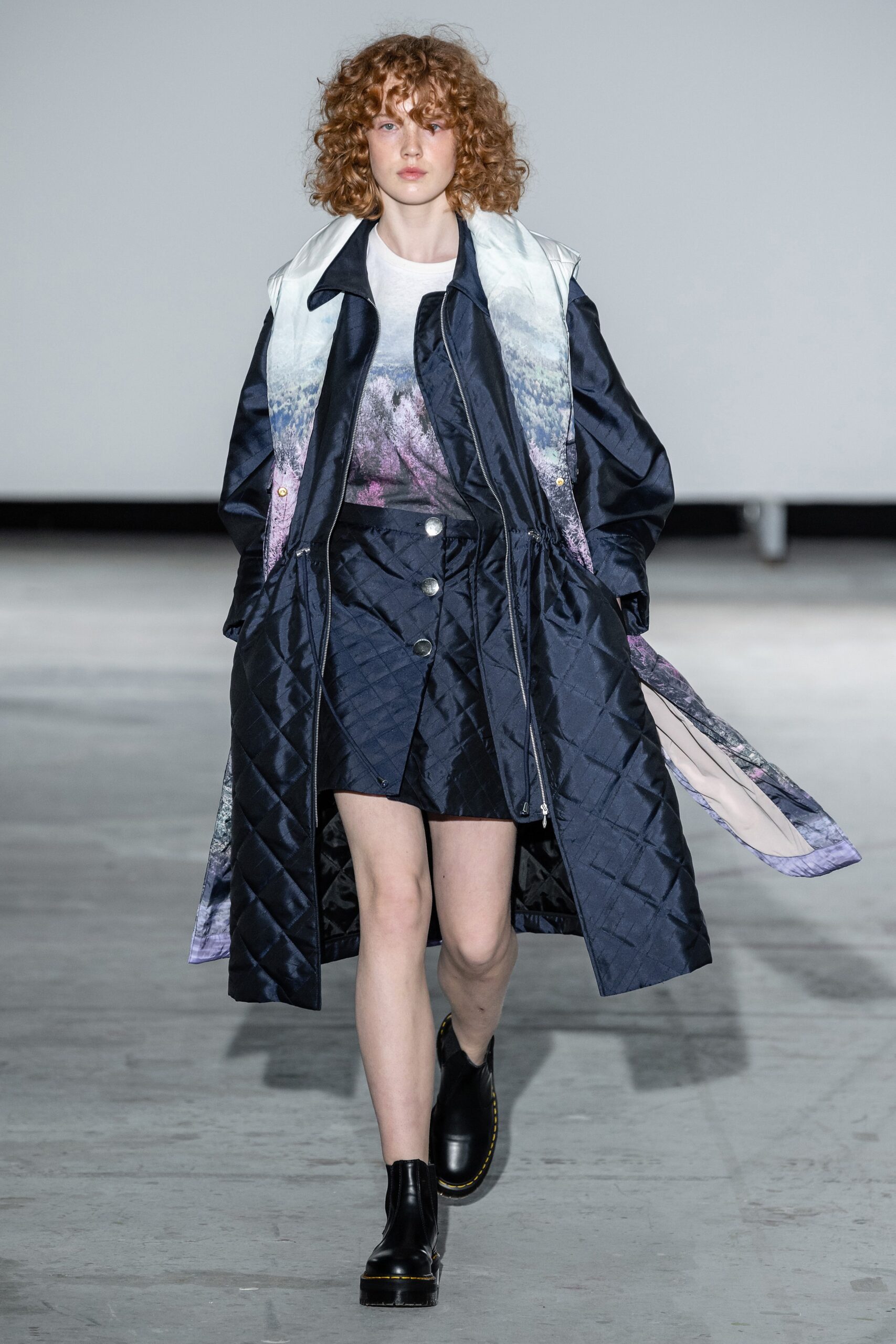 blue quilted coat with black skirt