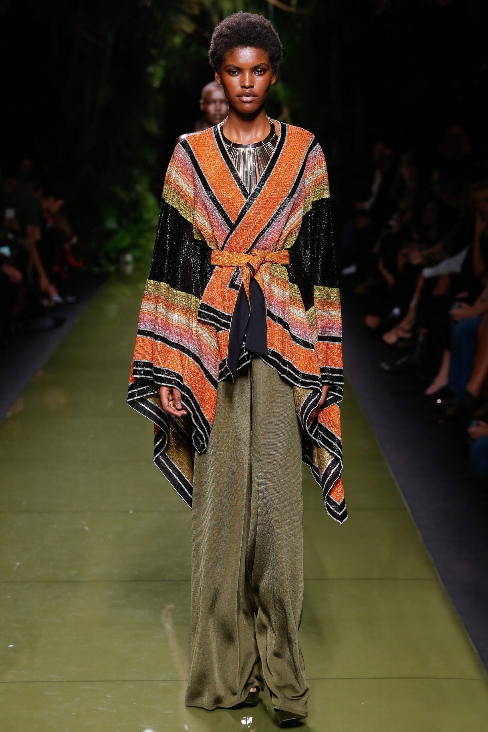 colorful layered cape with wide-leg pants