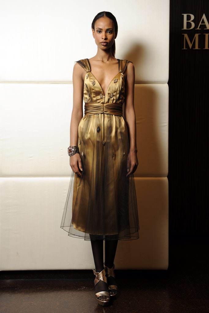 gold silk sleeveless v-neck fitted pleated draped dress