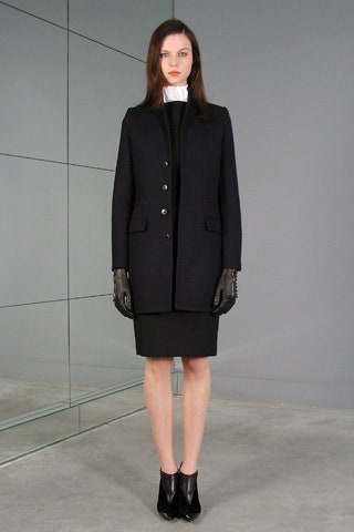 black structured coat and fitted dress