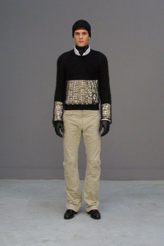 black and white fitted sweater with beige pants
