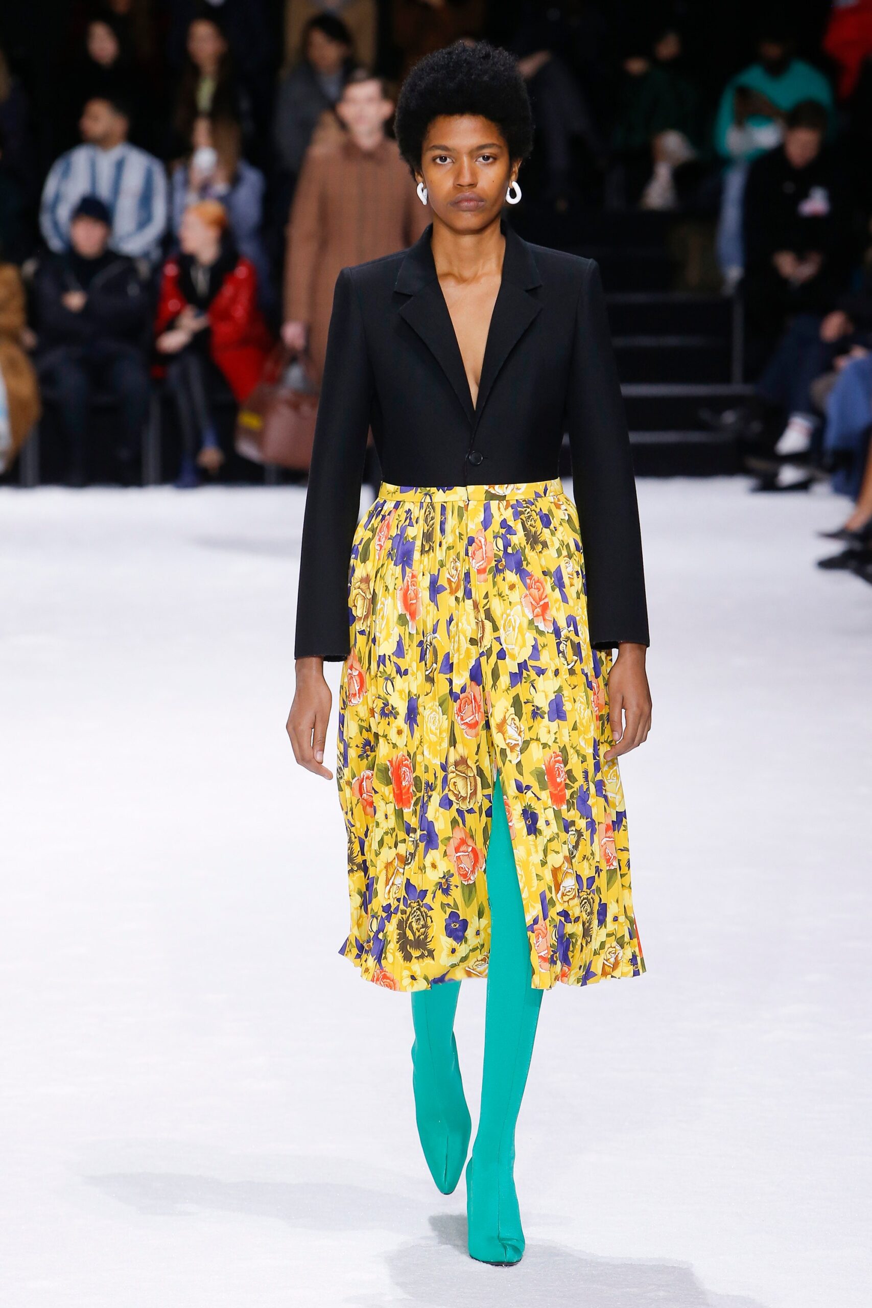 black blazer yellow pleated skirt