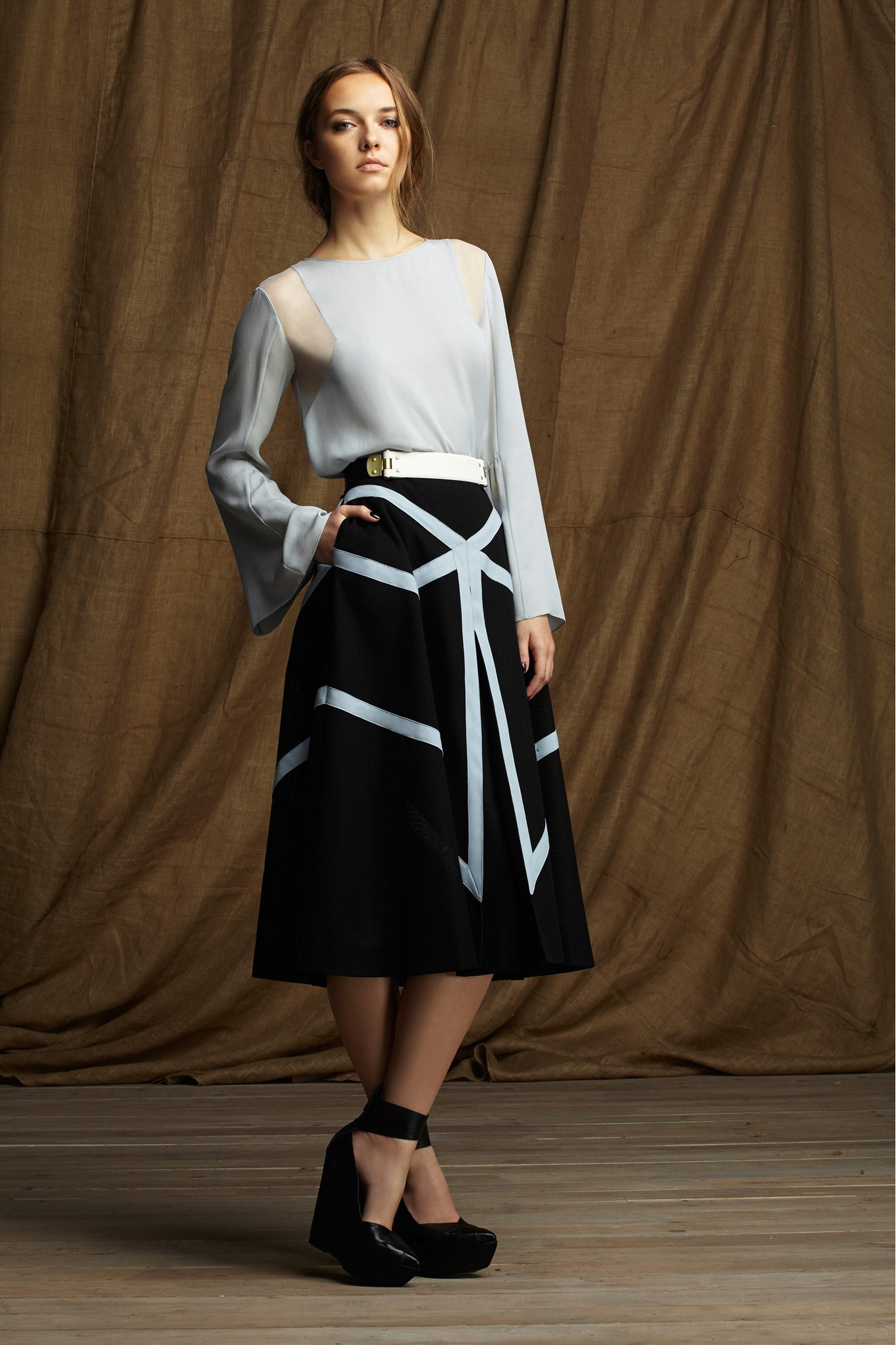white silk blouse and black midi skirt