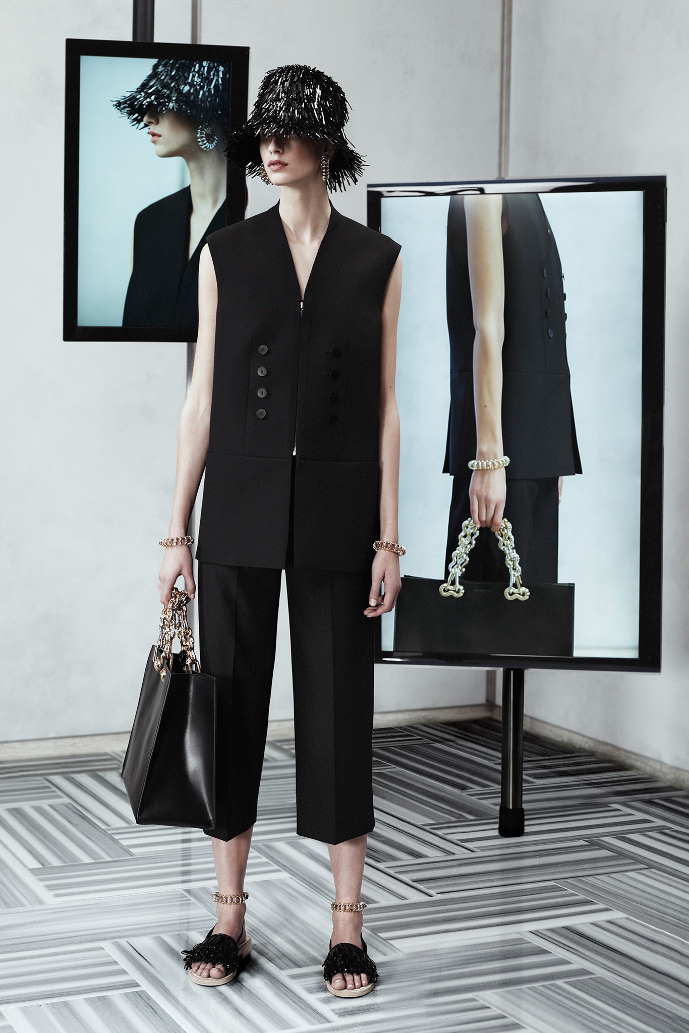 black fitted vest and relaxed pants