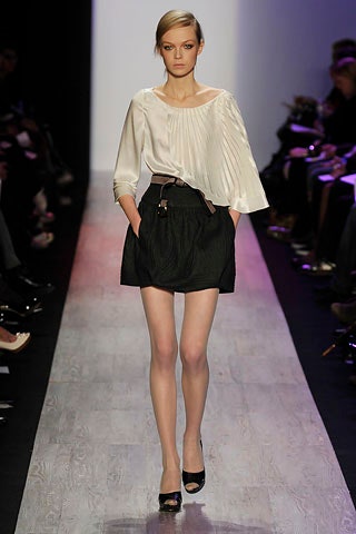 white silk pleated blouse with black skirt