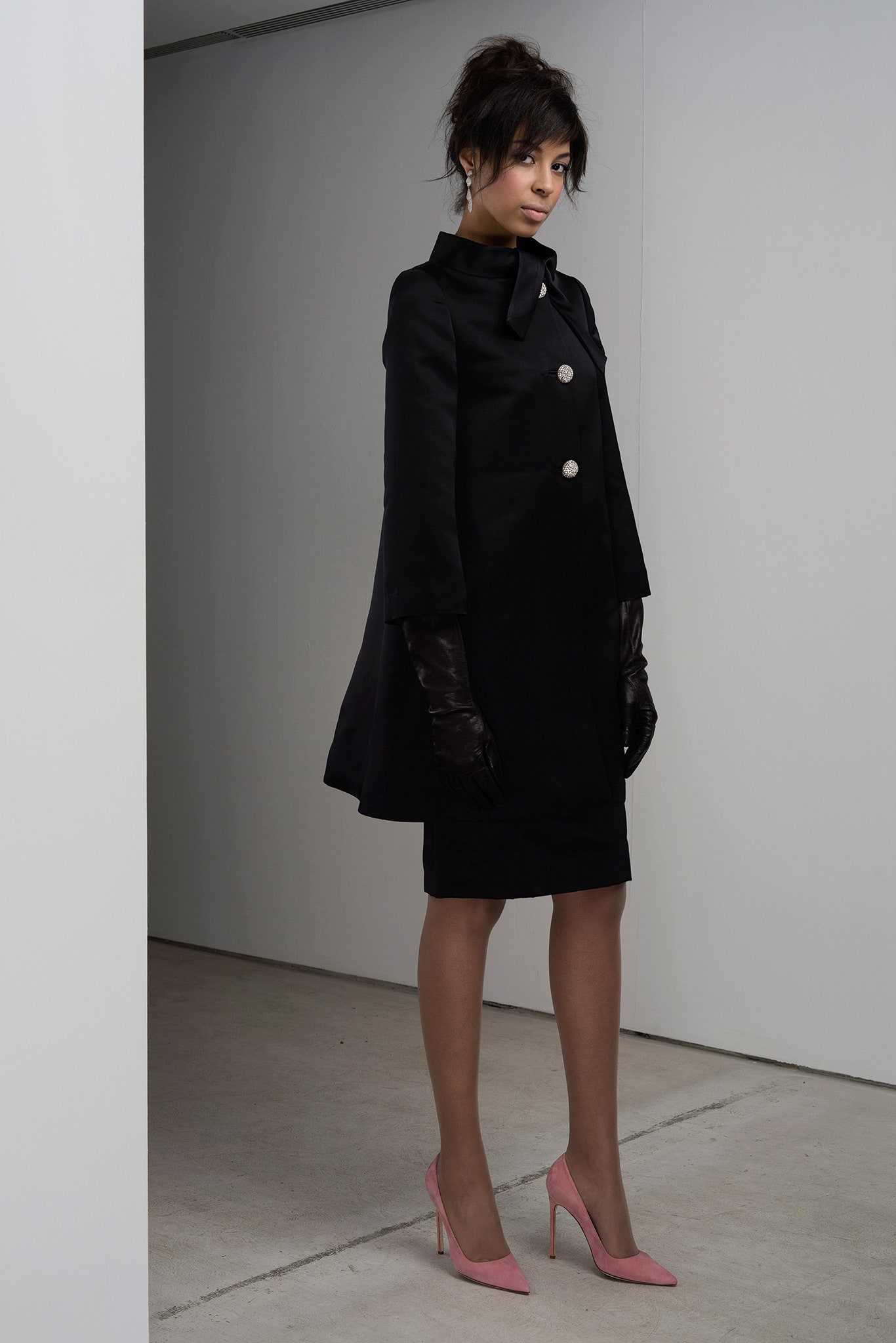 black coat and fitted dress