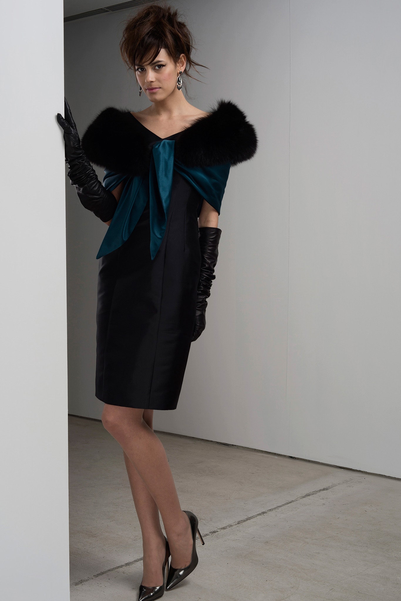 black fitted mini dress with teal cape