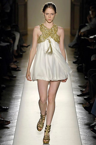white silk mini dress with gold shoes