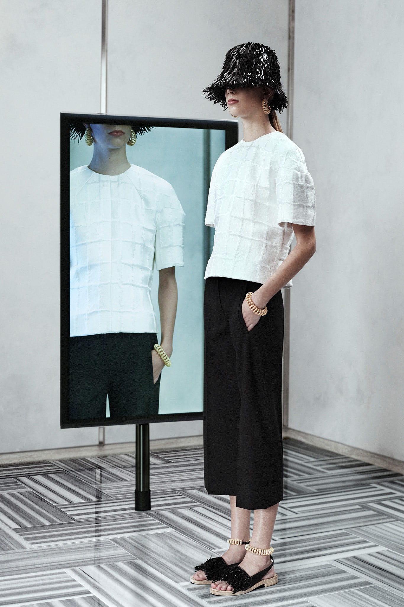 white fitted top with black pants