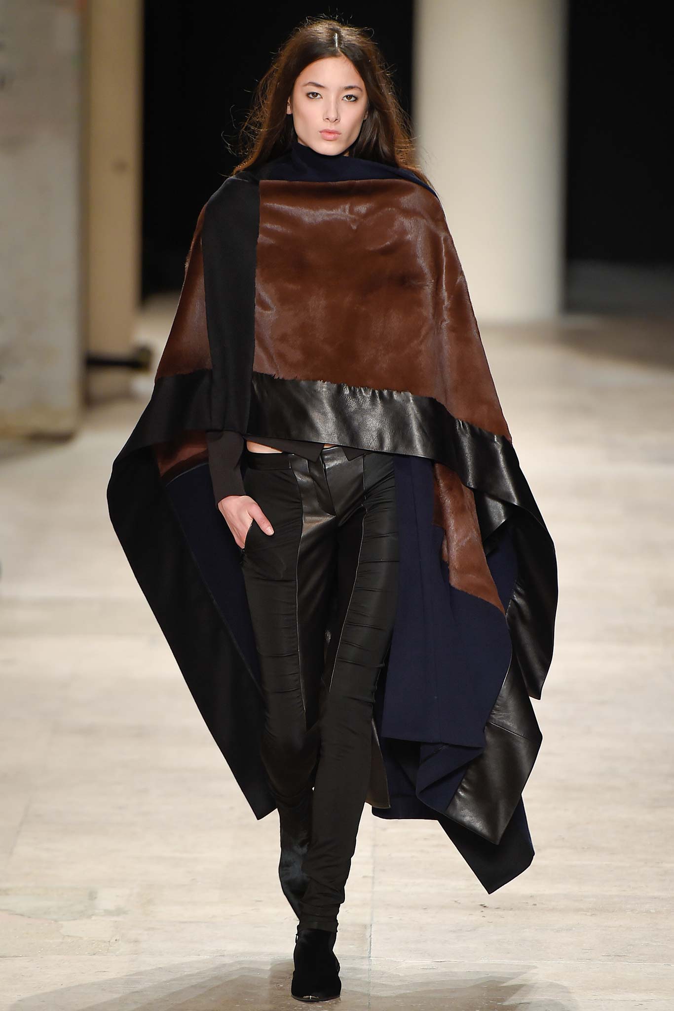brown leather poncho with black pants