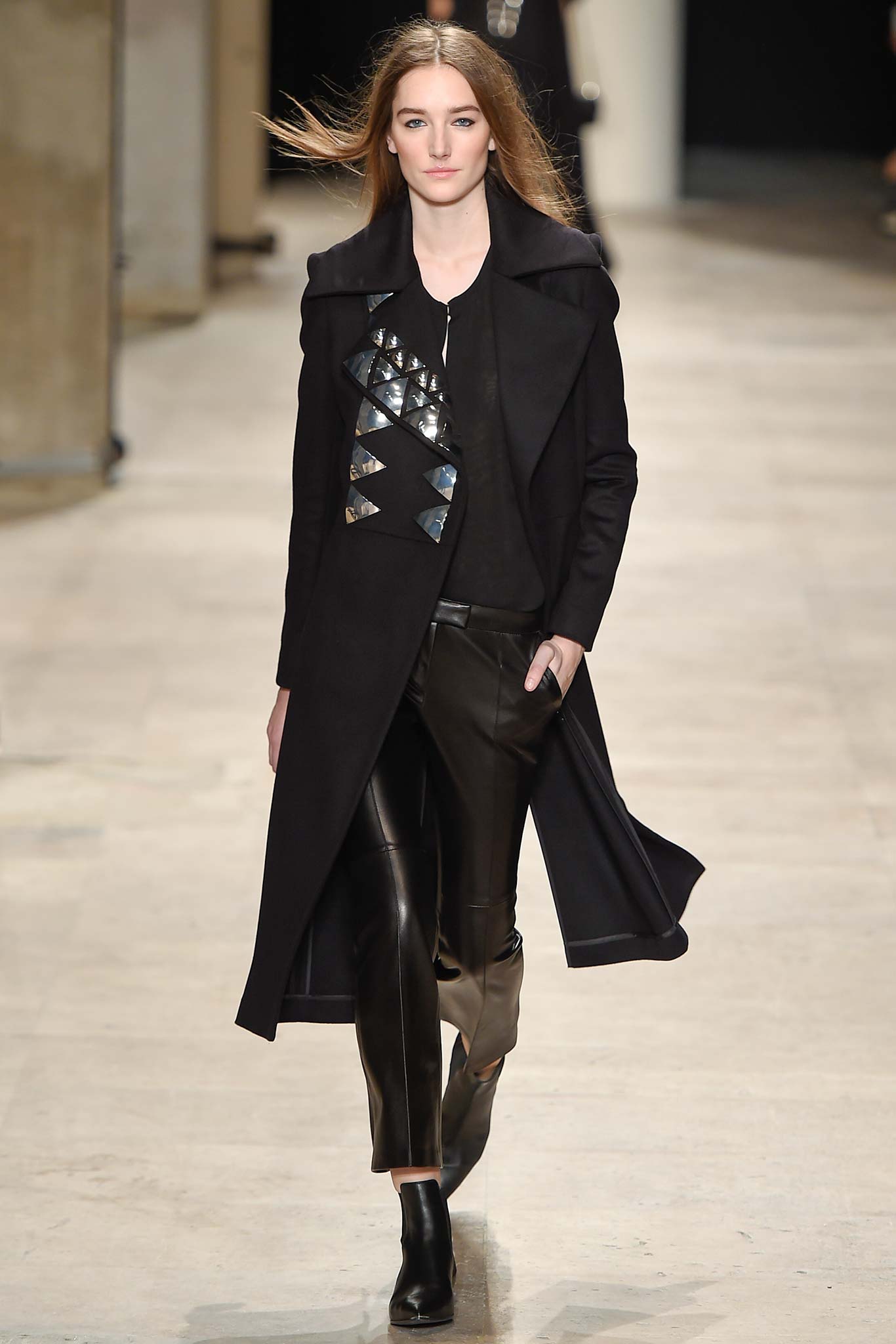black fitted coat and leather pants