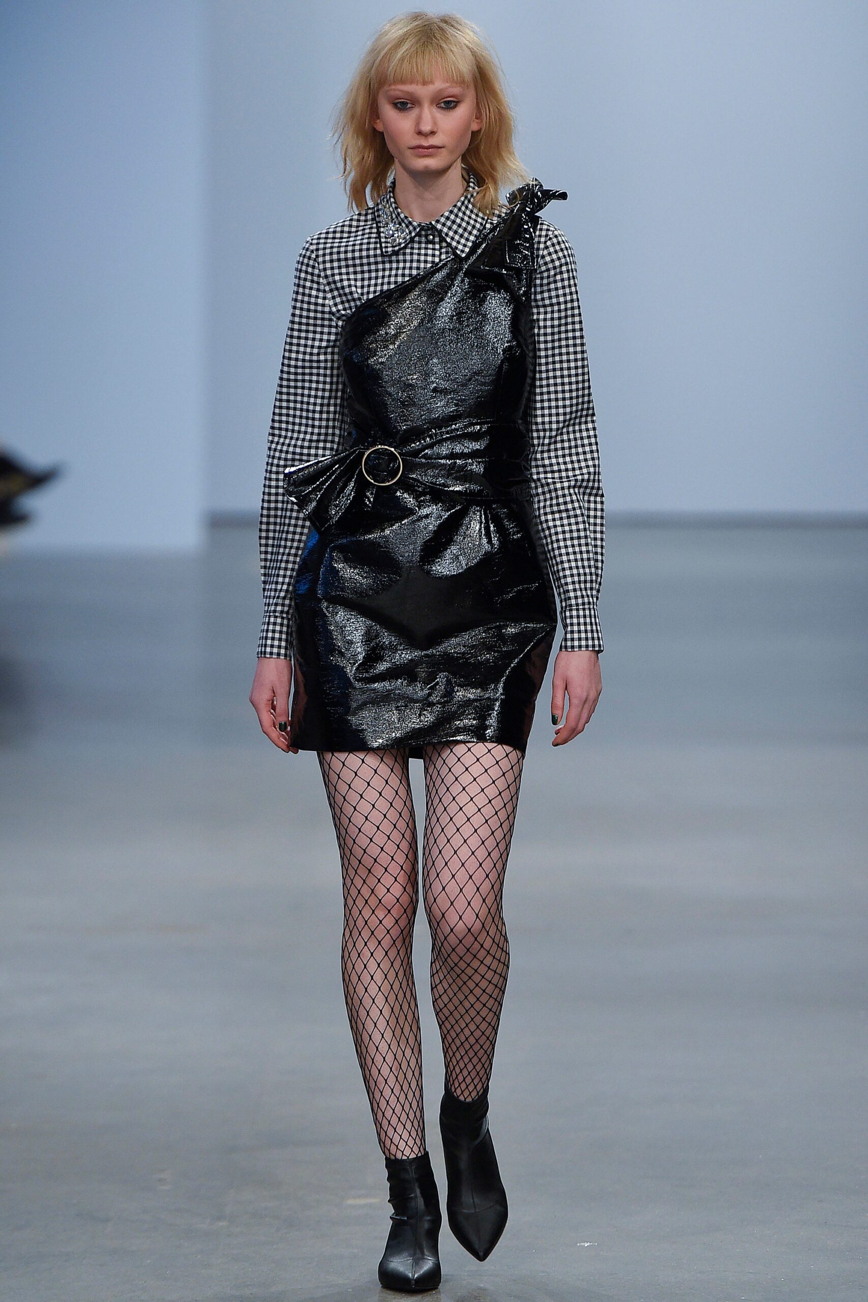 black vinyl asymmetric dress and checked shirt