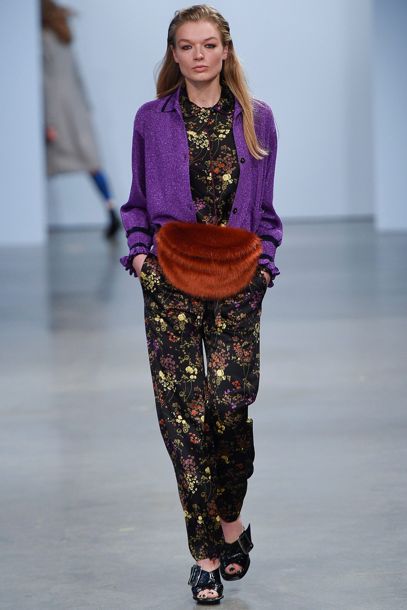 purple silk jacket and black jumpsuit