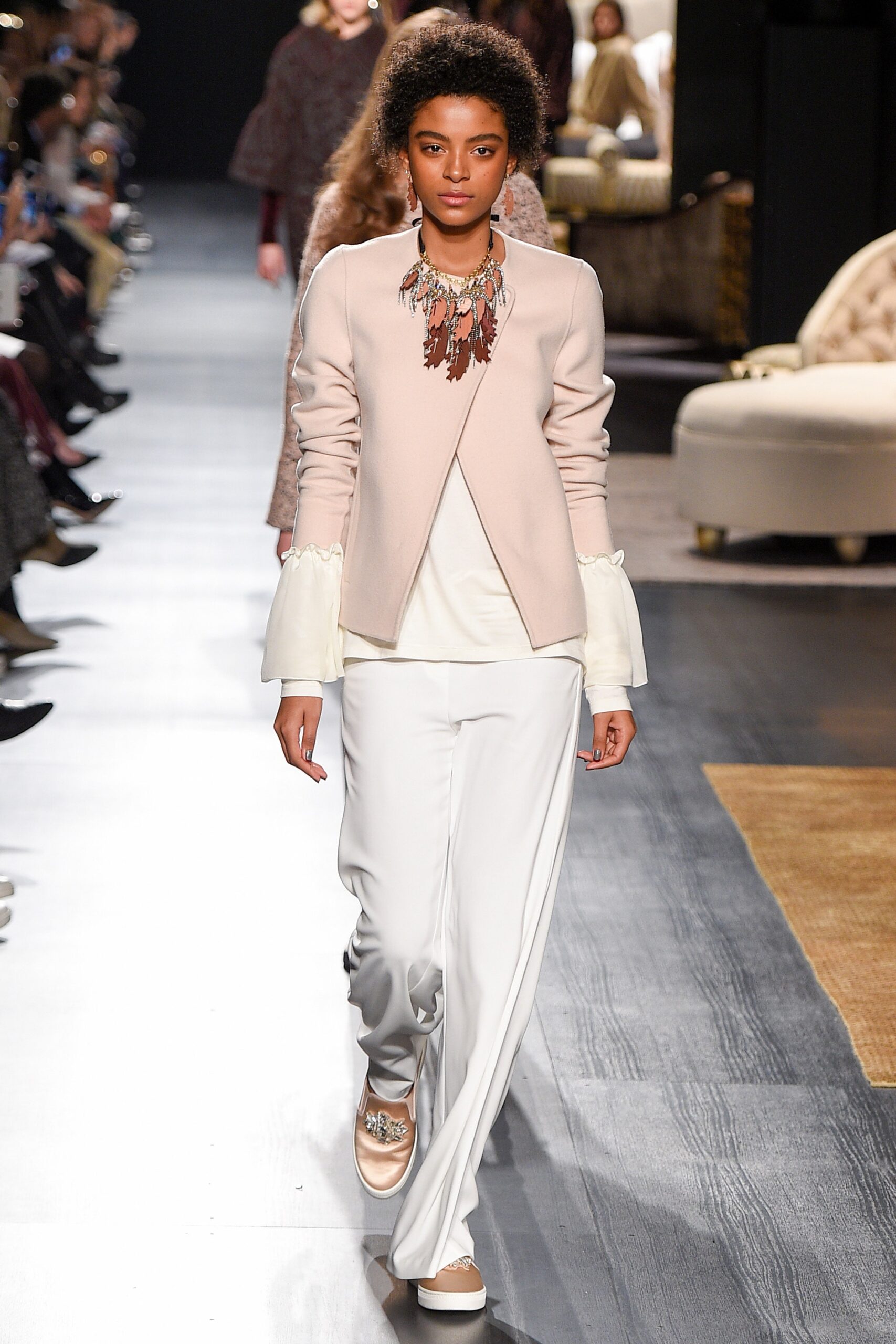 pink fitted jacket with white pants