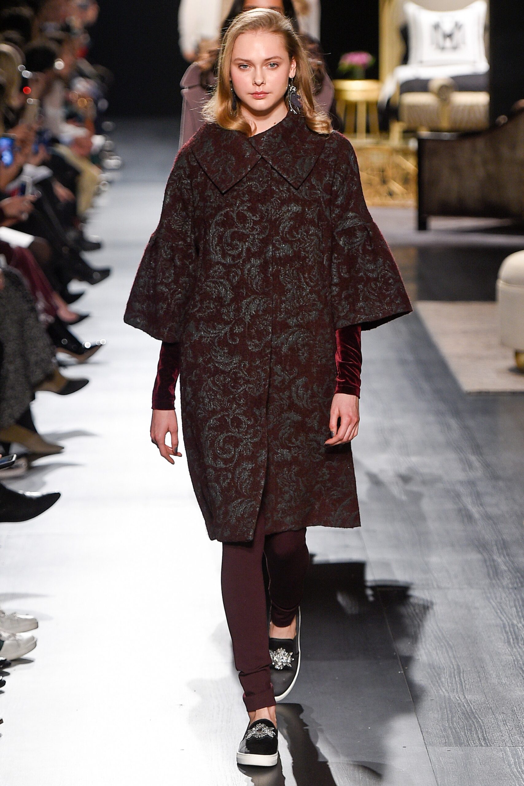 maroon embroidered coat with brown pants