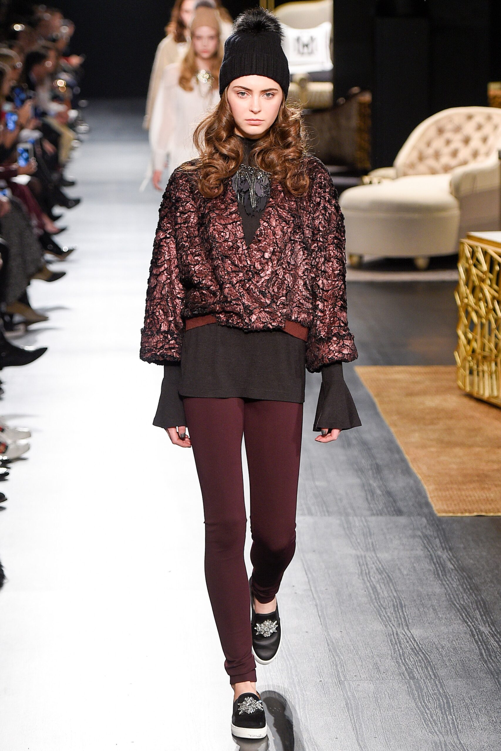 relaxed black top with maroon leggings