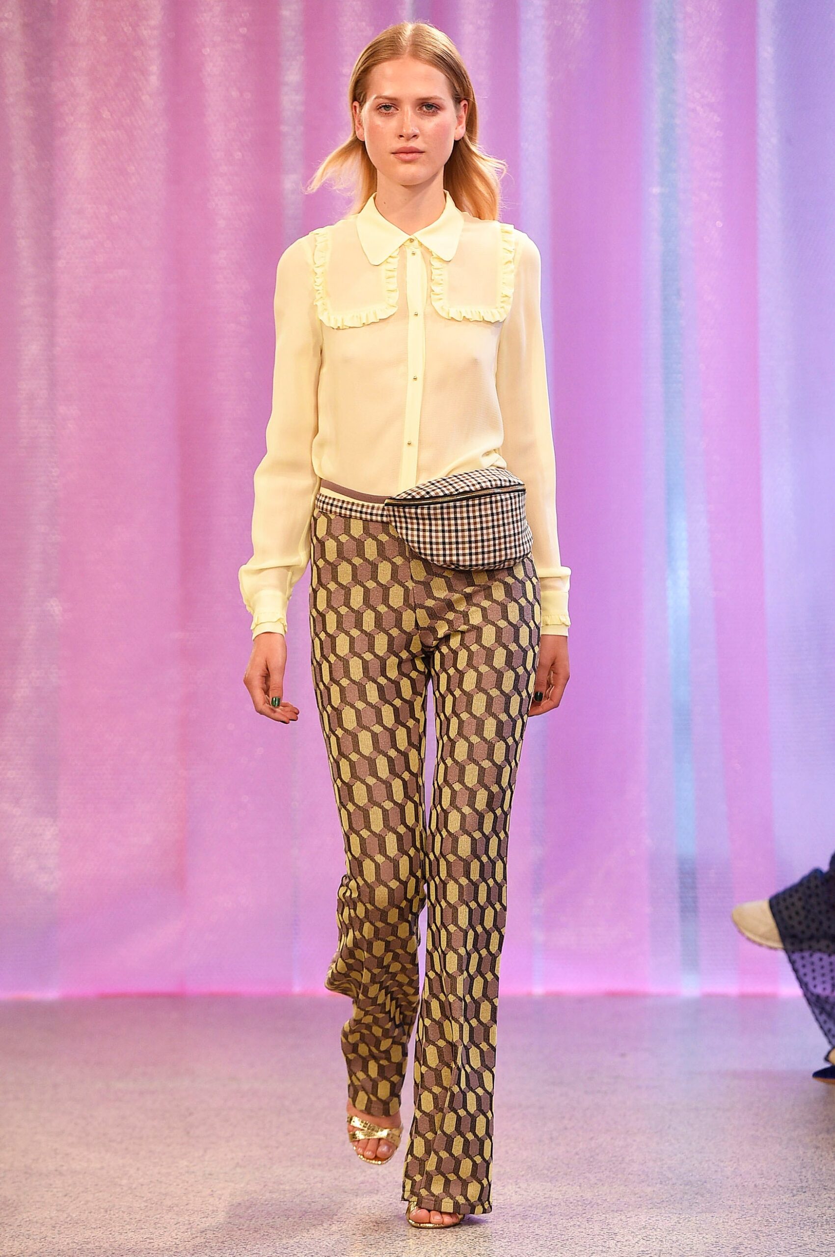 white ruffled blouse with multi-colored flared pants