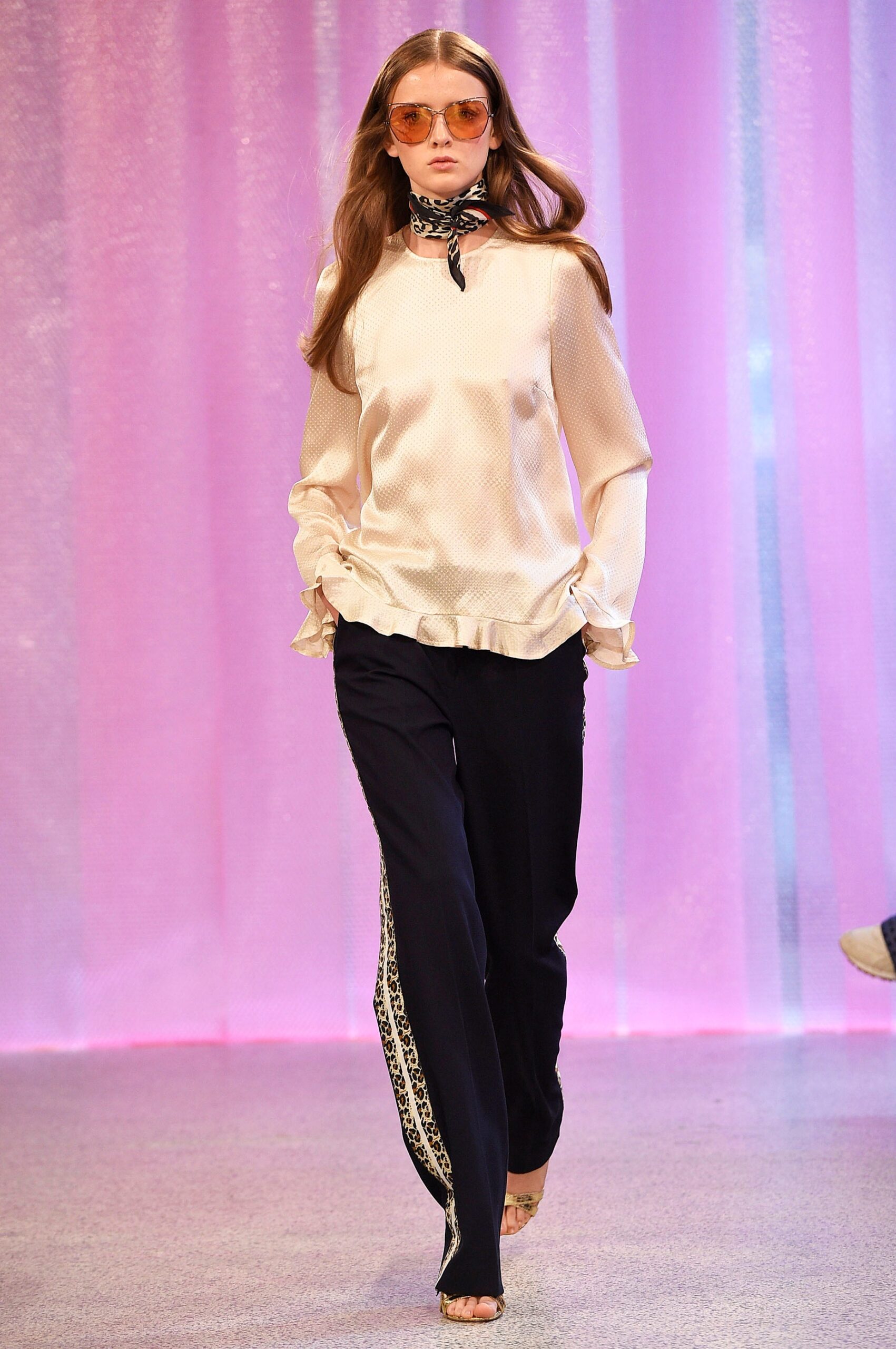 white silk fitted blouse and black relaxed pants