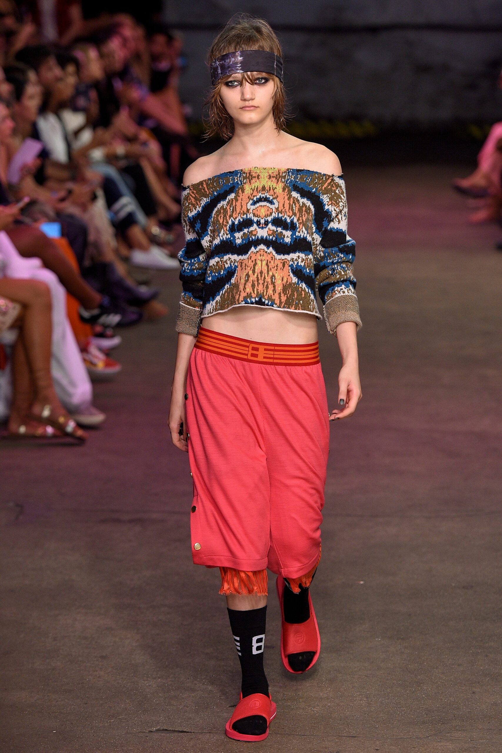 multi-colored off-shoulder sweater with red shorts