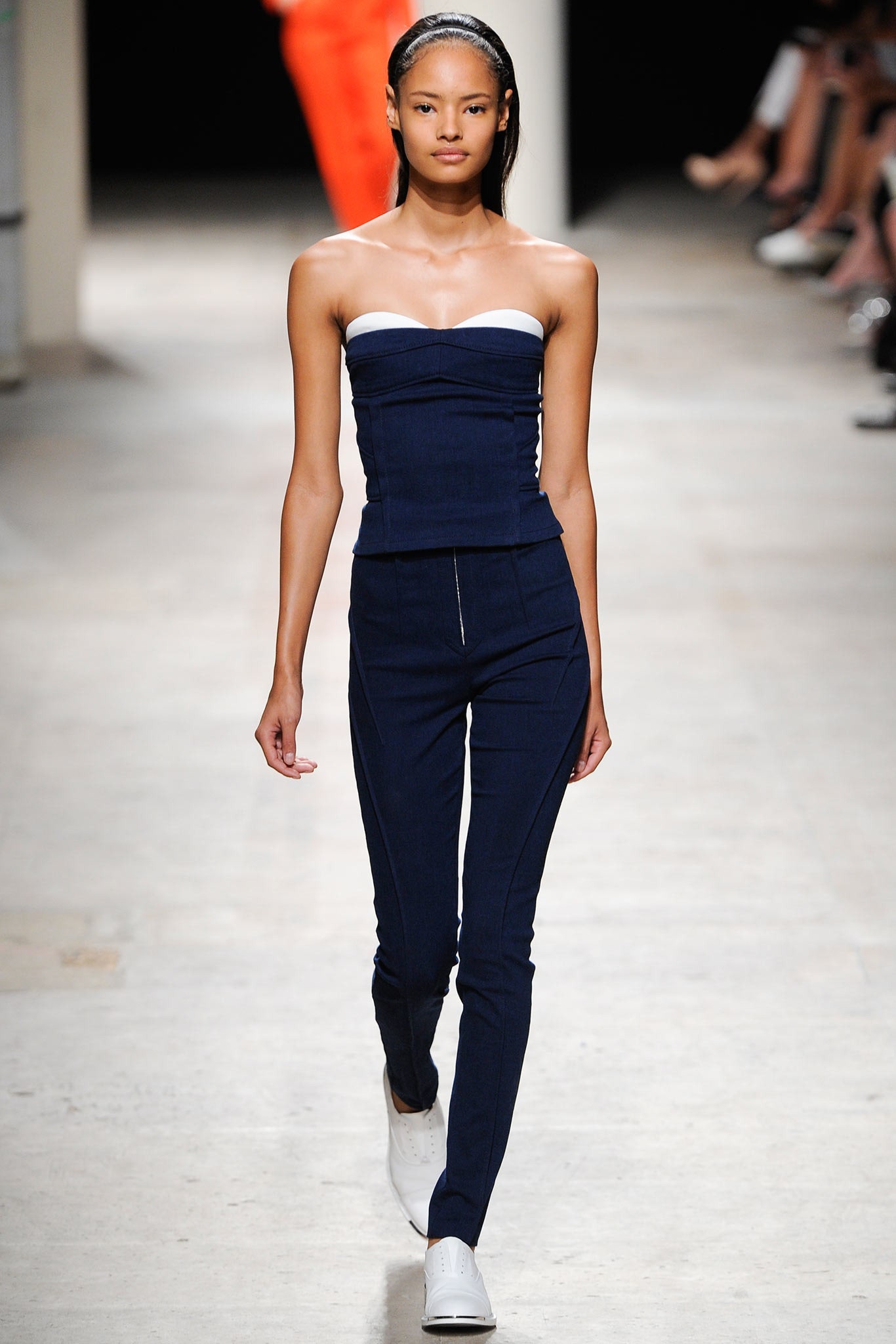 navy fitted jumpsuit with white shoes