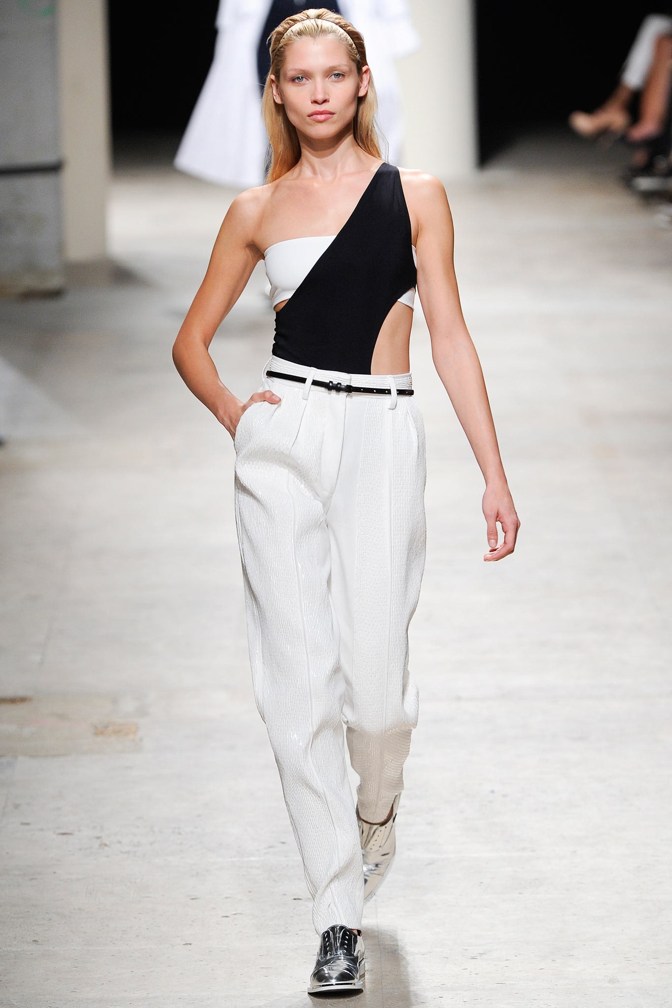 black and white asymmetric top with tailored pants