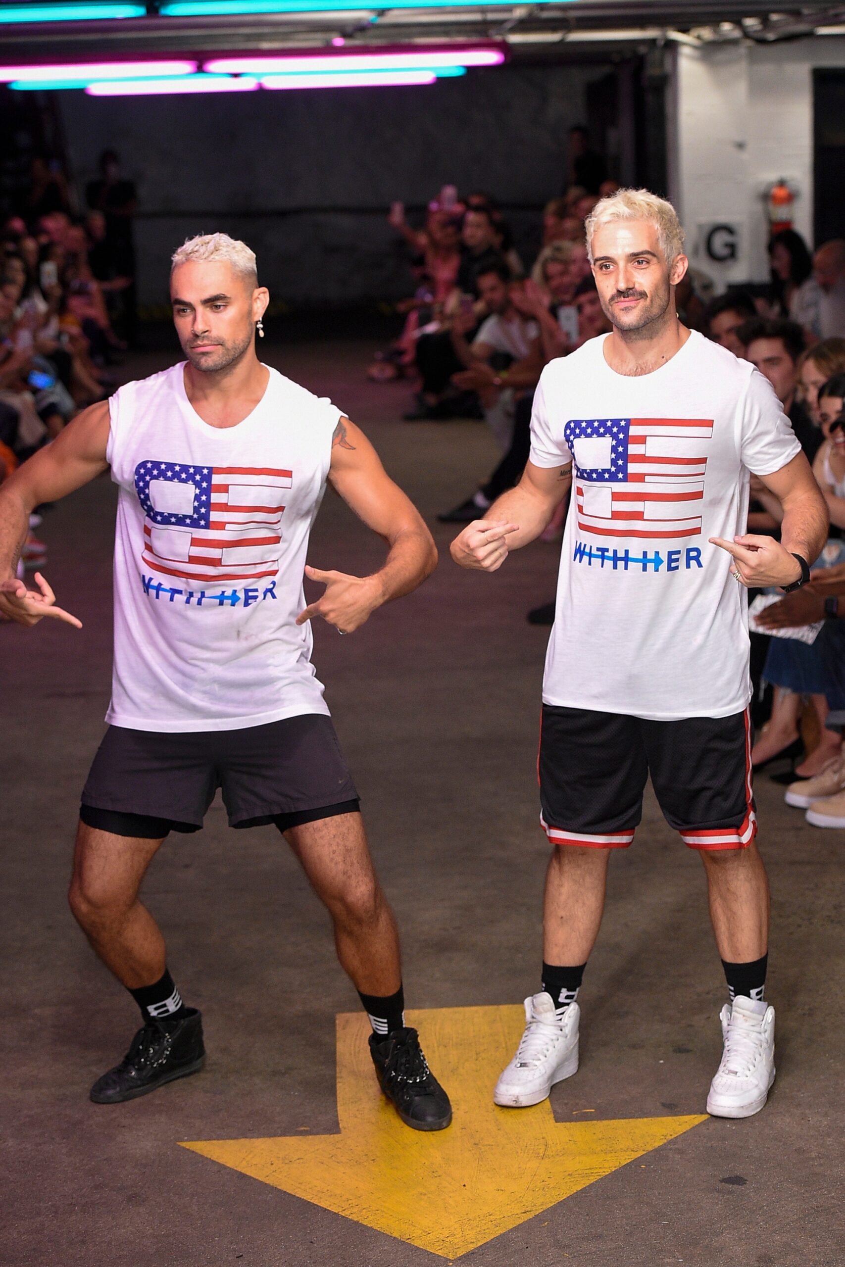 white printed t-shirt and black shorts