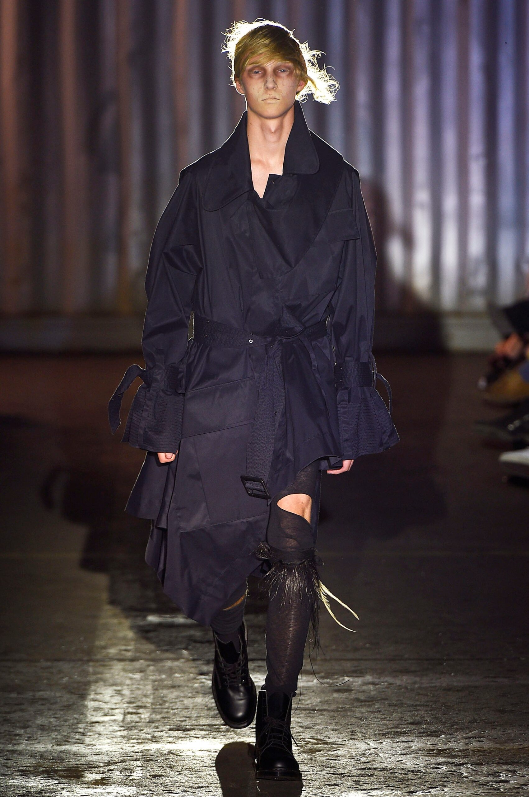 black relaxed coat with distressed pants