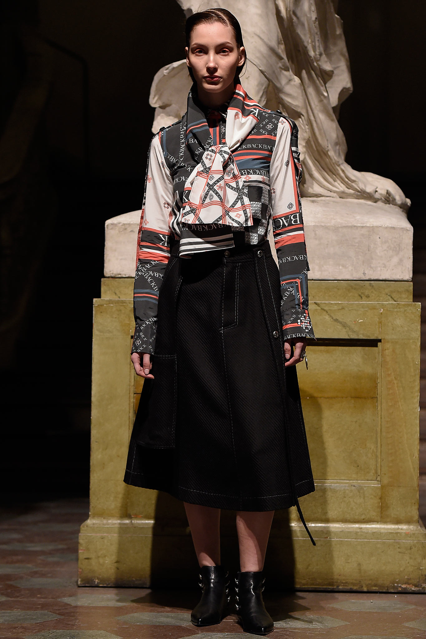 fitted printed shirt and black skirt