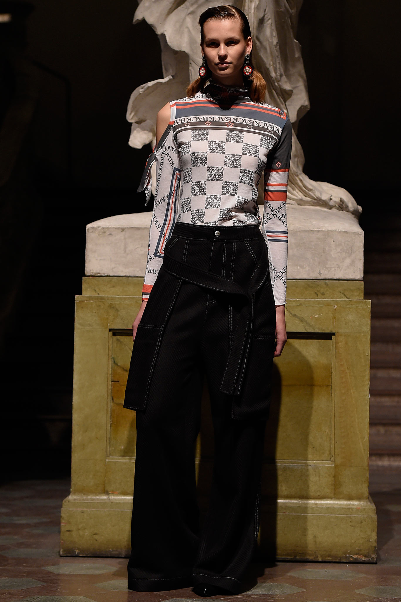 fitted checked top and relaxed black pants