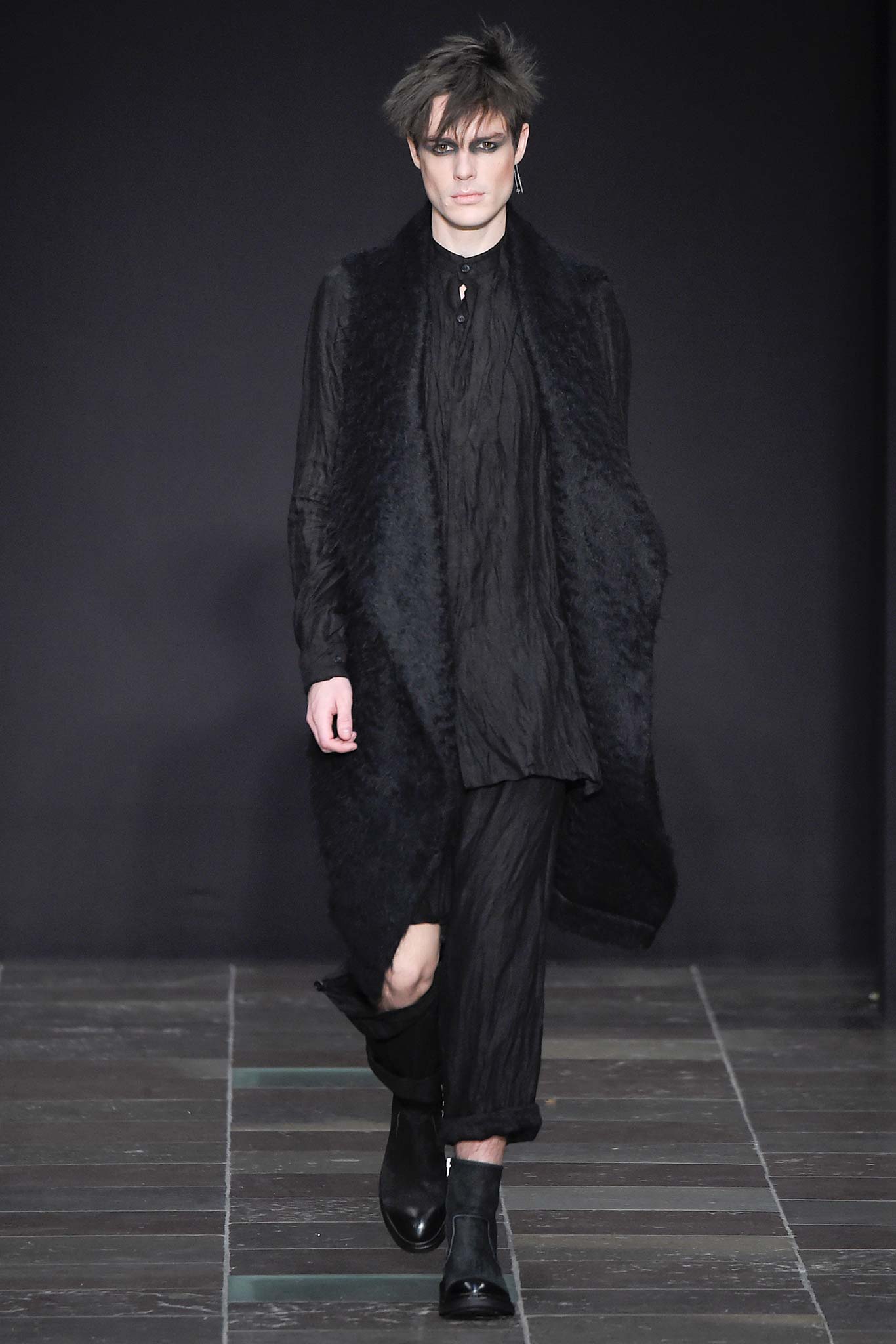black relaxed coat and fitted shirt