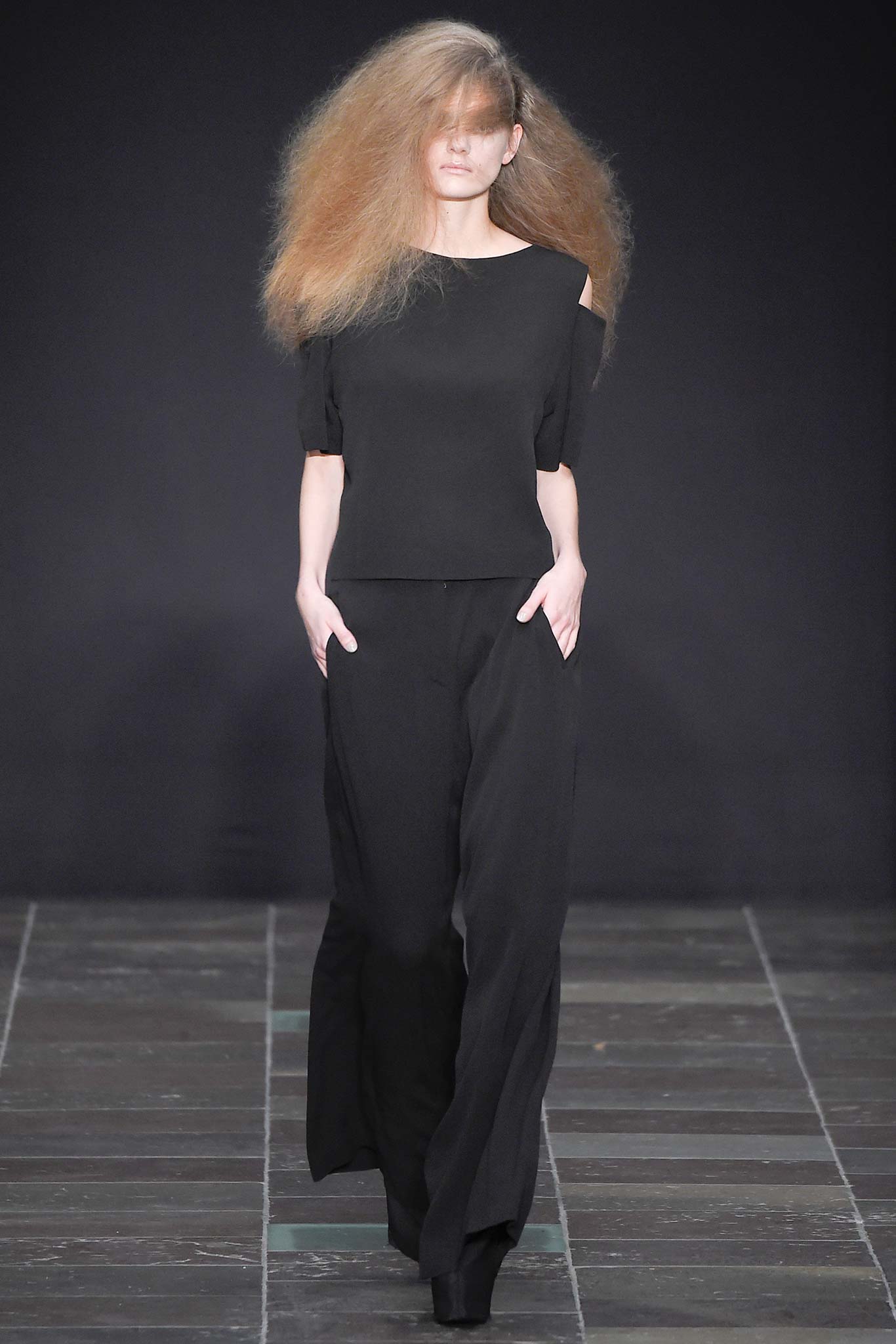 black fitted top and relaxed pants