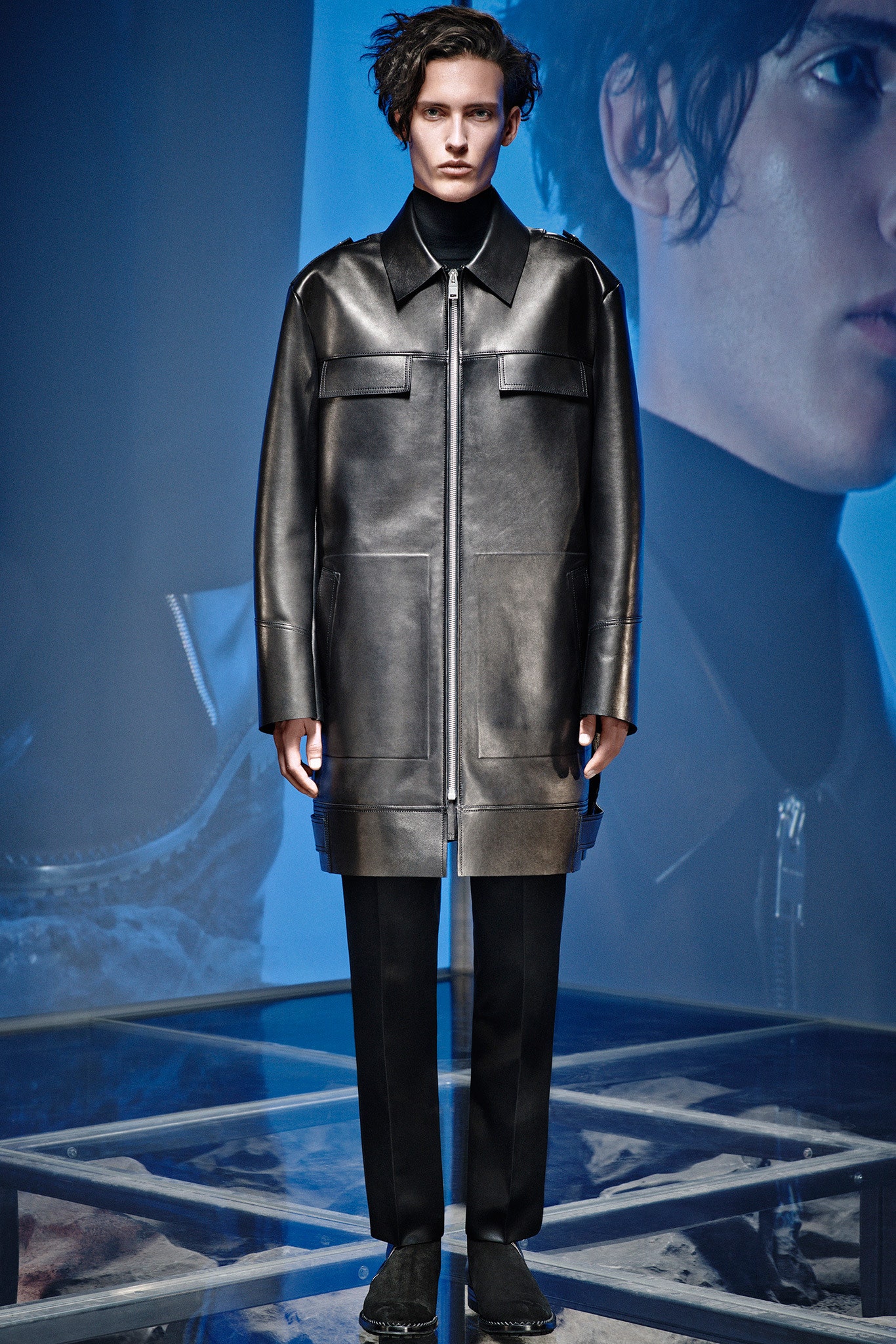 black leather coat and tailored pants