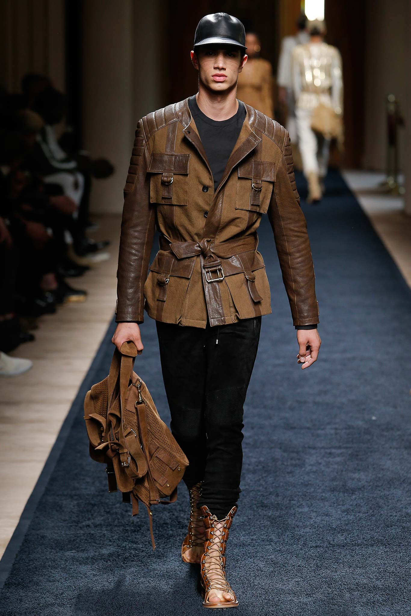 brown leather jacket with black pants