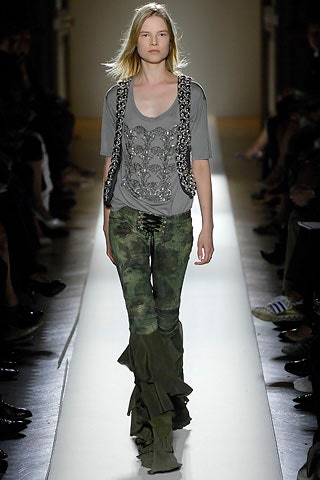 gray embroidered top with black vest