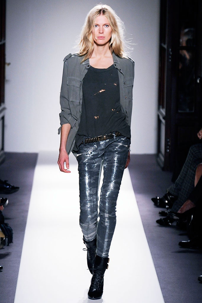 gray shirt black tank top silver pants