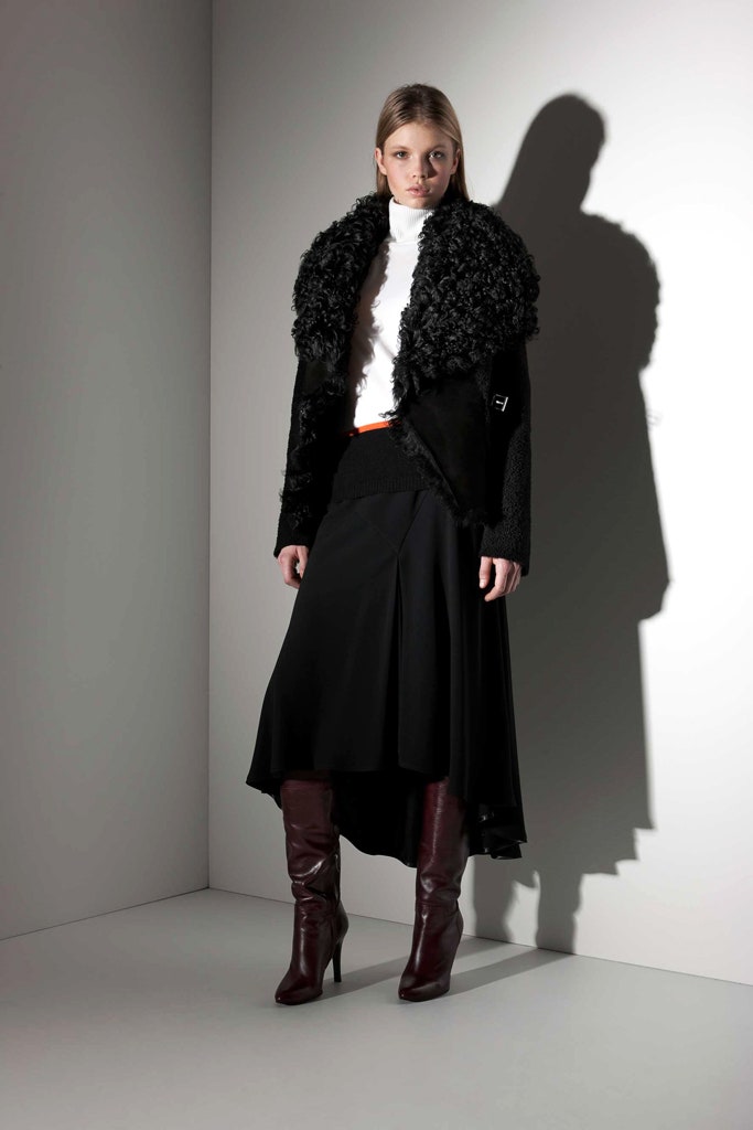 black faux-fur coat with white blouse