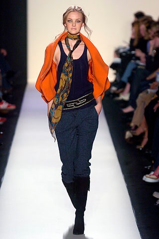 black fitted top with orange jacket
