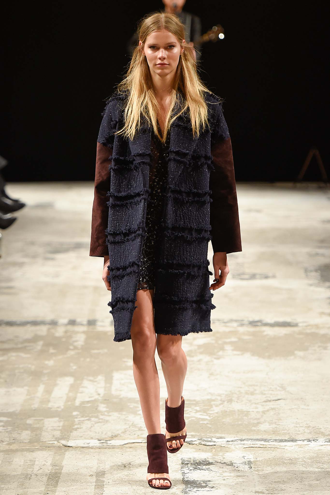 black coat with fringed detail