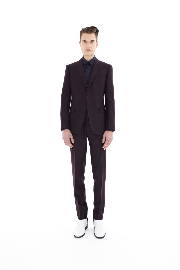 purple tailored suit with white shoes