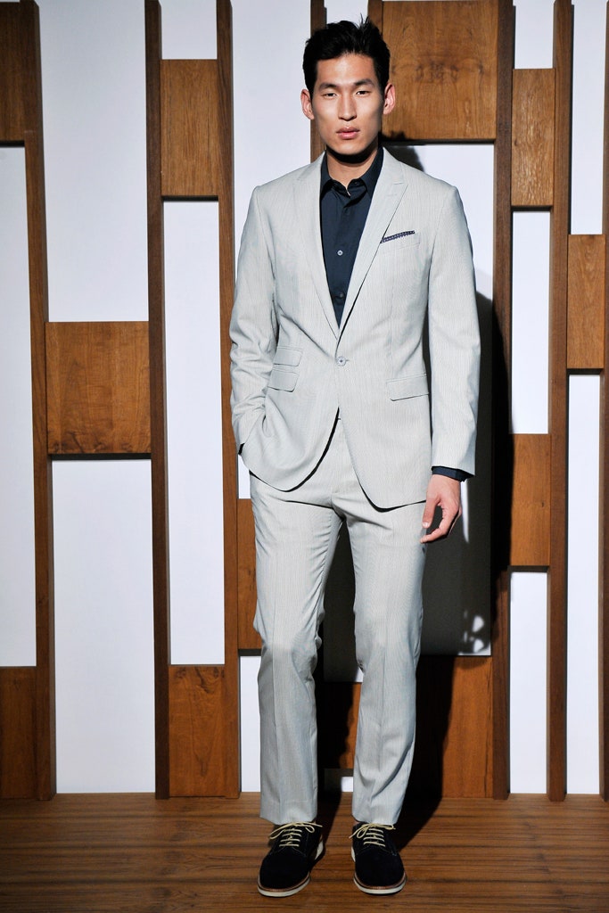 gray tailored suit with black shirt